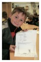 Proudly showing off a completed worksheet